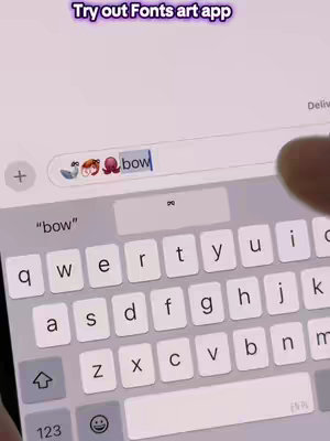 The cover image shows a close-up of a tablet or phone screen displaying a keyboard and a search bar. The search bar contains the text "bow" alongside three emojis: a swan, a girl character, and an octopus. The keyboard is visible below, with keys showing letters and symbols. Overlaid at the top is a rectangular call-out that says "Try out Fonts art app". The overall color scheme includes white, gray, and pink.