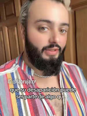 A man with a beard and colorful shirt is the main focus of the image. Text overlays and the creator's face.