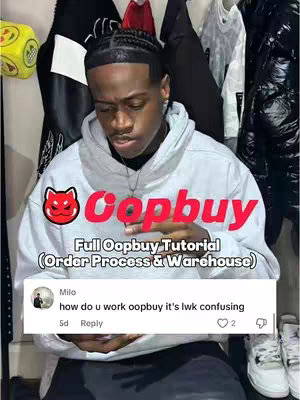 A young Black man in a white hoodie is centered in the image, the Oopbuy logo is positioned above his head with red text. Below, a comment thread from the app is visible.