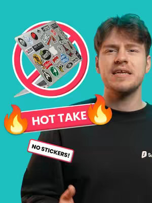 A man is in front of a teal background in a black sweater against a laptop and two overlaid text elements.