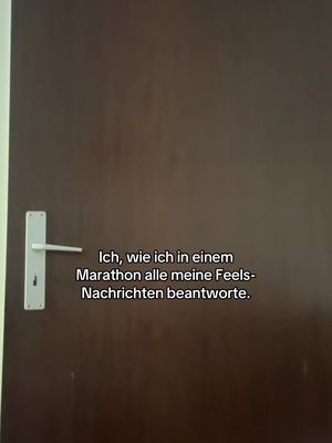 A medium shot shows a brown wooden door with a white handle on the left side. Text in a black box overlay is placed on the lower center-right of the door.