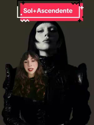 The image shows a black and white photo of a person, possibly a woman, with pale skin, heavy makeup, and dark hair covering her forehead. A smaller, inset video frame features a woman with long brown hair wearing red lipstick. The top-left corner has text in a box.