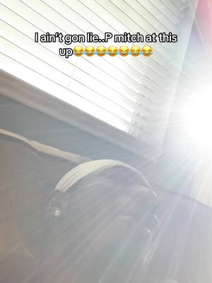 A dimly lit selfie with text overlayed. A person wearing a white durag is visible, with the top of blinds also in view. The light source is a bright, overexposed area on the right side of the image.