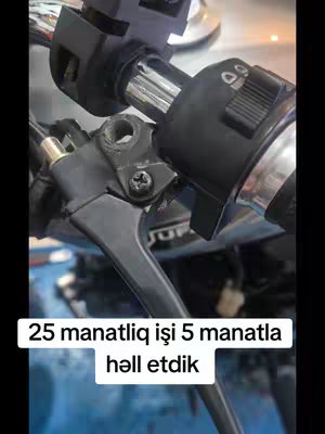 The cover image shows a close-up of motorcycle handlebars with the brake lever and controls visible. The foreground features the black brake lever, while other black controls and metallic components are visible, with a blurred background. The lighting is neutral, focusing attention on the mechanical details.