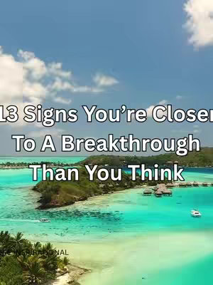 A scenic aerial shot featuring a tropical island with shades of blue and green, a stunning sea with several boats, surrounded by light-colored sand and greenery. The sky above is bright blue with scattered white clouds. Overlaid text is visible across the top.