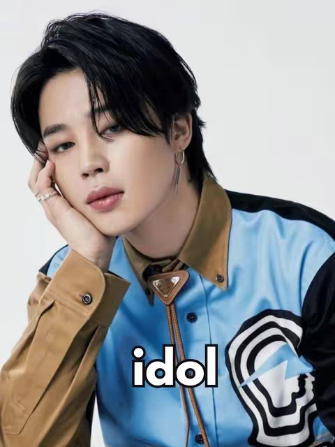 The cover image features a portrait of a man with black hair, posed with his hand on his cheek, looking slightly off-camera. The overlay text 'idol' is prominently displayed.