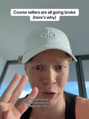 A selfie-style shot of a light-skinned man with light red hair wearing a white baseball cap. He is making a surprised or concerned face, with his eyes wide and his mouth slightly open. He is holding up three fingers. Written text overlays the top and bottom of the image.