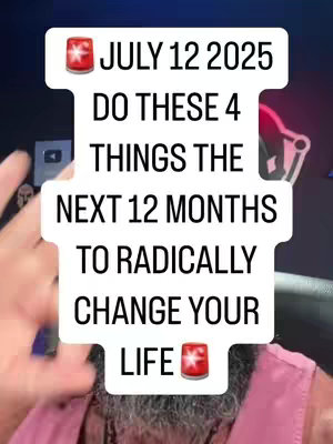 A selfie-style video cover image. The central element is a large, stylized text overlay in a rounded, white speech bubble design. The overlay features text in a bold, black font, asking viewers to focus on 4 specific things over the next 12 months to change their life. The background appears slightly blurred, with the creator's face partially visible. The creator has a beard and is wearing a simple shirt. The text overlay has a red and white emergency light icon at the top and bottom. 