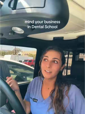 A woman is sitting in a car, looking toward the camera. The hook says mind your business in Dental School.