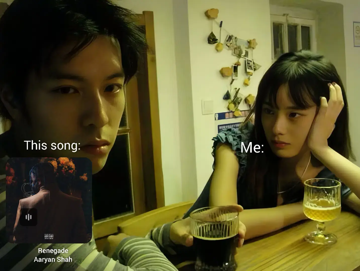 An indoor shot featuring two young people, a man and a woman, seated at a table. The man is in the left foreground, gazing directly at the camera, while the woman is seated in the opposite direction, gazing slightly away. They are each posed with a drink in hand. Overlaid on the image are text elements and what appears to be a music app interface.