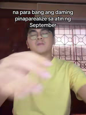 The cover image captures a man with glasses, looking up slightly with closed eyes, presumably speaking. Overlaid text says `na para bang ang daming pinaparealize sa atin ng September`. The man wears a yellow shirt. The background is partially obscured, with hints of a window and a wooden surface.