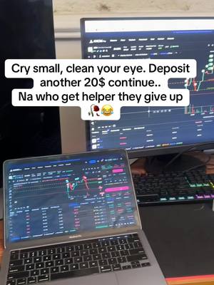 A person's workspace setup with a laptop and two monitors showing trading data, with text overlayed on the image.