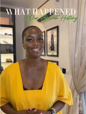 A well-lit interior shot featuring a Black woman in the center wearing a yellow top. She is smiling at the camera. Behind her is a shelf with fashion items, complemented by framed art on the walls.