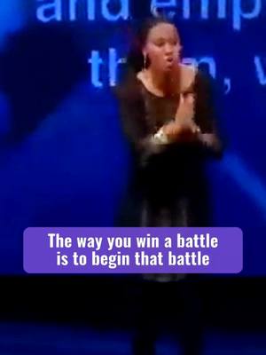 A woman, wearing a dark top, is in a dynamic pose with her hands clasped. A text box at the bottom states, 'The way you win a battle is to begin that battle'. The background is a gradient of dark blue colors.