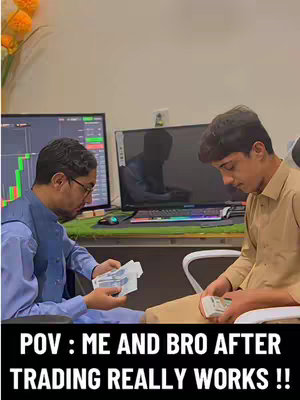 The cover image shows two men in an office setting. The man on the left wears a blue vest over a white shirt and glasses, looking intently at the money he holds. The man on the right, in a tan shirt, also looks down at the money in his hands. A computer monitor with a stock chart is visible behind the first man, and a screen is at the center of the background. The caption "POV : ME AND BRO AFTER TRADING REALLY WORKS !!" is at the bottom.