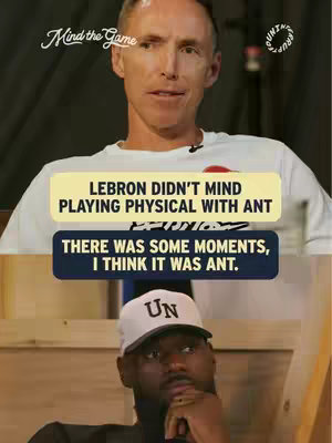 The cover image is a vertical split shot featuring two individuals. The top half presents a light-skinned man, possibly in his 40s or 50s, wearing a white t-shirt with a small circular design on it. Below him are two text boxes with white text, one yellow at the top and a darker one below it. The bottom half showcases a Black male wearing a white baseball cap with "UN" on it and a black shirt. The background is a mix of light and dark with a wooden fixture.