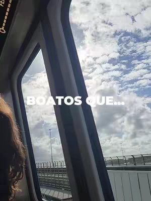Inside view of a vehicle with a view out the window of a cloudy sky and a bridge. The focus is on the window with text overlayed showing the hook.