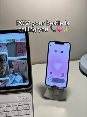 The cover image displays an iPhone in a phone holder with a background of a table and a laptop on the left.