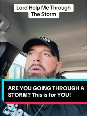 A man, wearing a black cap, is seen from the chest up inside a car, looking surprised and concerned. Two lines of text are stacked above him and one is below.