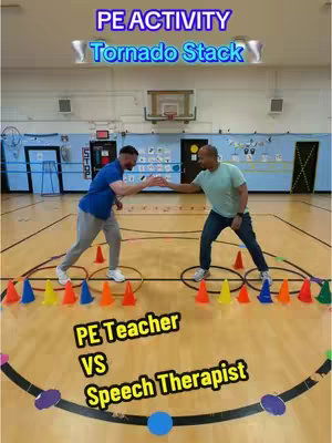 The image shows two men in a gymnasium setting, presumably involved in a physical activity game. Yellow, orange, and green cones are arranged in rows on the wooden floor. Above is text that reads 'PE ACTIVITY Tornado Stack'. The men are positioned in circles, with their hands extended toward each other and a series of cones nearby. The overall composition is simple, colorful, and action-oriented, indicating a focus on physical education and teamwork.