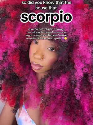 The cover image is a face close-up featuring a dark-skinned person centered with pink and red curly hair. They have a nose ring and are wearing light makeup. The background is heavily blurred and colored in pink shades. Text is overlaid at the top, written in white, describing the content.