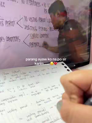 A person's hand is writing notes on a sheet of paper, while the camera shows a whiteboard with notes on it as well, and another person's face is reflected in the background. The hook text is overlaid on the image.