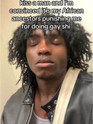 The cover image is a close-up of a young Black man with curly hair and a leather jacket. The man's eyes are closed, and he has a neutral expression. Text overlay in white at the top.