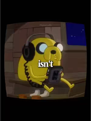 The cover image features Jake from Adventure Time, the cartoon character, sitting with headphones and a music player. The words 'isn't' are overlaid on the image. The background is a dimly lit, indoor environment with a window showing a night sky.