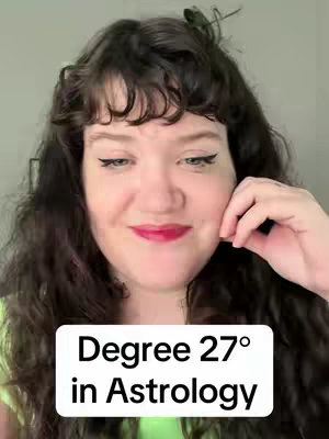 A woman with curly dark hair and red lipstick smiles at the camera. A white rectangular box at the bottom of the image displays text with the video title.