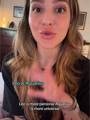 A woman with long wavy hair is positioned in front of a domestic backdrop. The background shows a dresser, painting, and lamp. Text overlay indicates "Leo & Aquarius" and a description comparing the signs.
