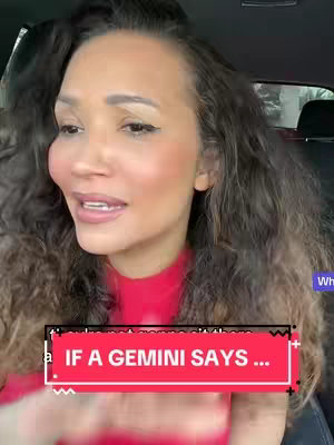 A woman with long, wavy brown hair is seated inside a car, likely filming from the driver's or passenger's seat. She's looking towards the left of the frame and speaking, wearing a red top. A text overlay in a red rectangle with black borders and a white font across the bottom of the frame reads, "IF A GEMINI SAYS ..."