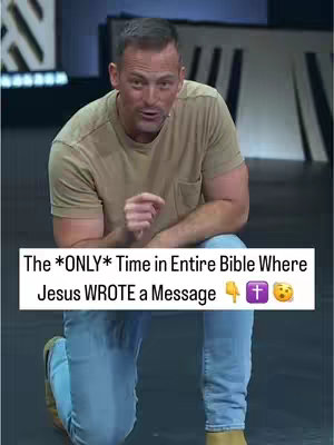 A man wearing a tan shirt and blue jeans kneels down and leans slightly forward. Above him, a text bar reads, 'The *ONLY* Time in Entire Bible Where Jesus WROTE a Message'.