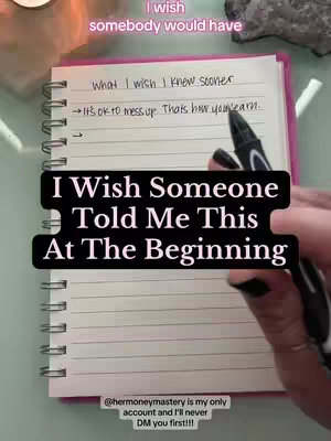 The cover image shows a notebook open to lined pages, with handwritten notes visible. The text overlay reads, 'I Wish Someone Told Me This At The Beginning.' A hand with black nail polish is seen holding a pen above the notebook. The background is blurred, suggesting a flat surface, and a small candle and crystals are visible.
