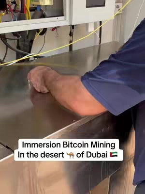 The cover image shows a person's arm and hand reaching towards a shiny, metallic surface, which appears to be part of some kind of machinery or equipment. The person seems to be inspecting or interacting with the surface. The upper part of the image includes electrical wiring and parts that are part of the machine.