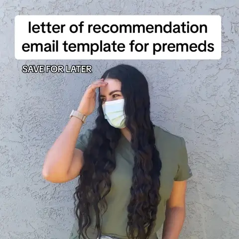 A woman with long, wavy dark hair, wearing a light green scrub top and a light blue face mask, is captured from the chest up with her right hand raised to her forehead. She's positioned slightly off-center to the right against a textured gray background.