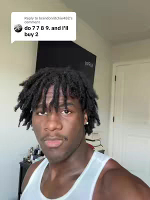 The cover image features a Black man positioned from the chest up. He has dark hair styled in short dreadlocks and is wearing a white tank top. Above him, a comment overlay is displayed in a speech bubble.