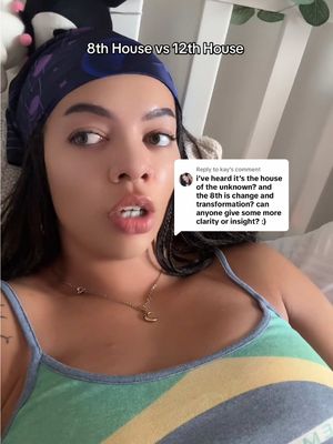 A woman is in a bed, looking towards the viewer, with overlay text at the top, and another text overlay on the right of the image. She is wearing a blue head wrap, a tank top, and a necklace.
