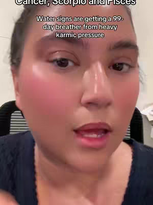 A close-up shot of a woman's face, with text overlayed at the top. The woman has dark hair and is looking directly at the camera. Her skin appears dewy, and she has makeup on her cheeks and lips. The lighting is soft and even.