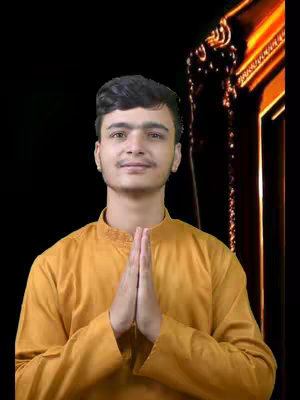 A young man is centered in the frame, wearing a mustard-colored outfit, and striking a namaste pose, with hands pressed together. The image is set against a simple backdrop with a black background, and a golden decorative element. The lighting is soft and even.