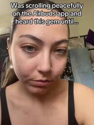 A close-up of a young woman's face, looking directly at the camera with a slightly questioning or contemplative expression. The background is blurred, but hints at a domestic setting with clothing visible. Text is overlaid on the image.