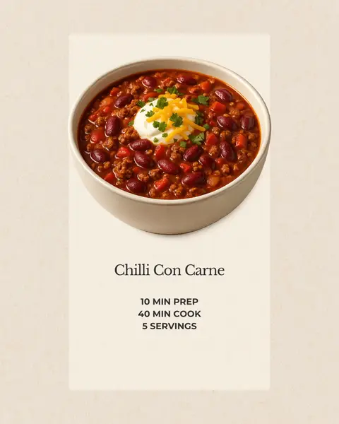 The image shows a creamy bowl of chili con carne, garnished with a dollop of sour cream, shredded cheese, and chopped parsley. The chili is a deep red color, with visible beans and ground meat. The bowl sits on a white background, with text in a sans-serif font below the bowl.