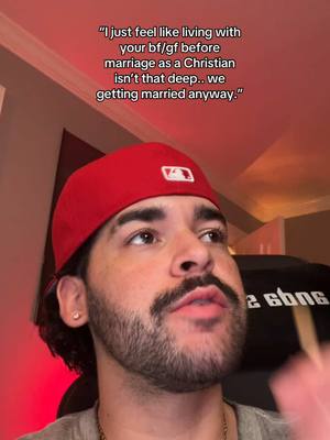 A man with a red hat and a serious expression, looking up and to the side. Text overlay provides context to the discussion.