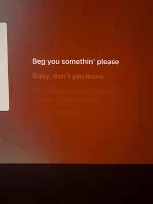 The image has a warm, reddish-orange gradient background. Centered and in white text, a short lyrical excerpt is displayed, reading, "Beg you somethin' please, Baby, don't you leave."