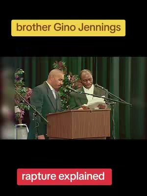 The image showcases two men, presumably pastors, standing behind wooden podiums in a church setting. The man on the right is reading from a paper, while the man on the left stands beside him. The background features a green curtain and floral arrangements.