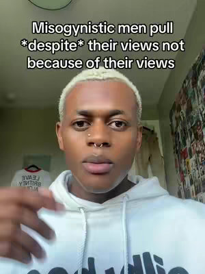 A medium shot shows a young man with short, bleached blonde hair. He has a nose ring and is wearing a white hoodie. The background is blurred but includes a glimpse of a white shirt on a hanger and some wall art. Text overlays read "Misogynistic men pull *despite* their views not because of their views."