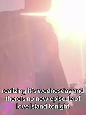 The image shows an out-of-focus figure against a bright, almost blinding, background. The person appears to be in silhouette with a pinkish glow, likely lit by a strong light source. Text overlaid on the image reads 'realizing it's wednesday and there's no new episode of love island tonight'.