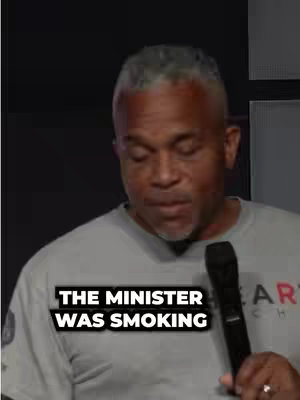 The cover image shows a Black man speaking into a microphone. Text overlay at the bottom of the center of the image reads: "THE MINISTER WAS SMOKING". The background is dark.