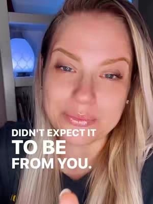 A close-up shot of a woman with blonde hair and makeup. The text overlay reads, "DIDN'T EXPECT IT TO BE FROM YOU." The background is blurred.