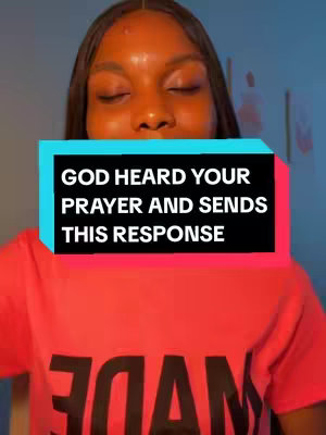 A woman with dark skin and dark hair is centered in the frame with a red shirt, eyes closed. A text overlay in a rectangle is positioned over the upper part of her body.