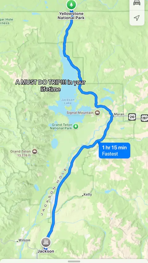 A map displaying a road trip route through Yellowstone National Park and Grand Teton National Park. A blue line highlights the route, with text overlays indicating the destination and travel time. The overall composition is a screenshot of a map application, with a clean, informative layout.